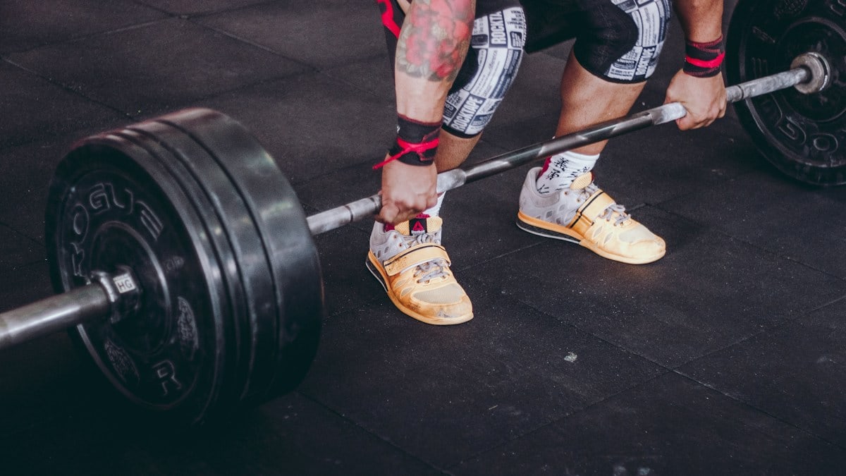 person holding the barbell